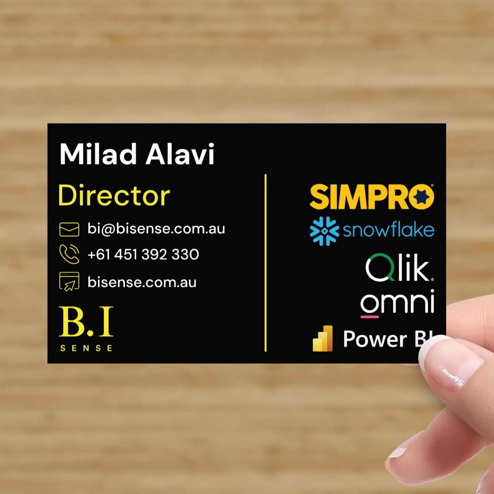 B.I Sense business card back design featuring contact details, platform logos and premium black and yellow brand styling.