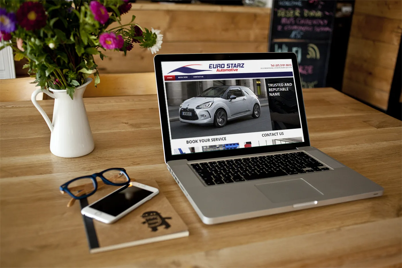 Euro Starz Automotive business card design — front-side brand and reverse-side service list.